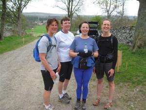 A group of hapy walkers takes a break at the Lord's Bridge checkpoint